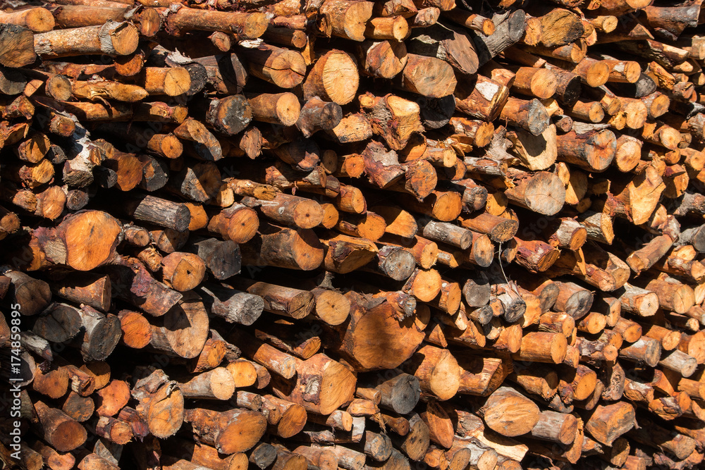 Fototapeta premium Natural wooden background - closeup of chopped firewood.