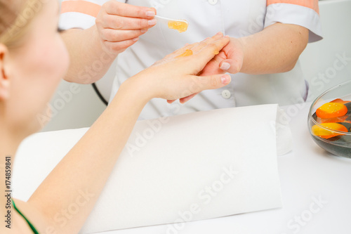 Woman getting hand massage at beauty salon