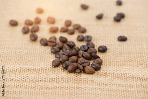 Fototapeta Naklejka Na Ścianę i Meble -  Coffee bean.Roasted coffee bean on burlap background.