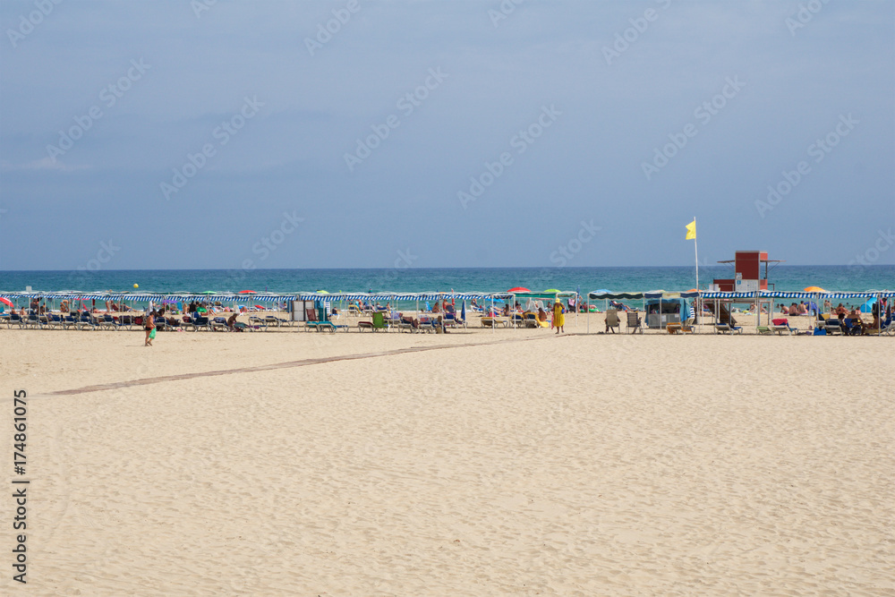 CAMBRILS, SPAIN - AUG 27th, 2017: Sandy beach on the Costa Daurada in the province of Tarragona, Catalonia