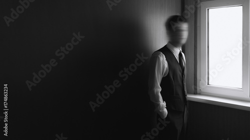 Black and white of young man with blurred face