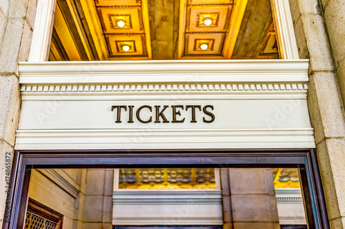 Photography Transportation tickets sign inside building with golden lights