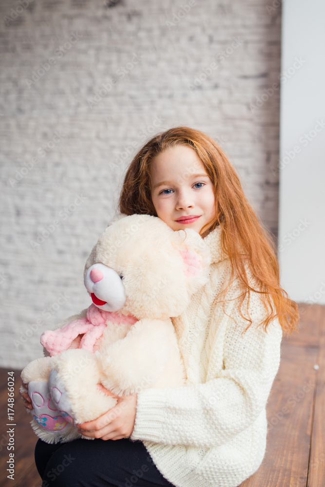 beautiful red-haired girl with Teddy bear beautiful red-haired girl with Teddy bear
