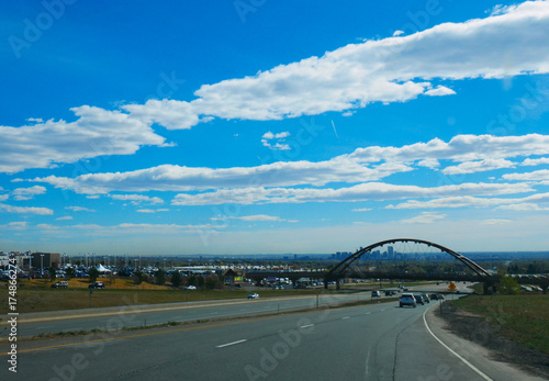 DENVER/COLORADO - APRIL 7, 2017: A view from highway in Denver, Colorado, USA on a sunny day and blue