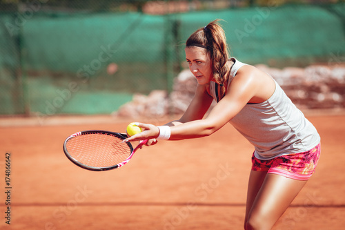 Female Tennis Player Serving © milanmarkovic78