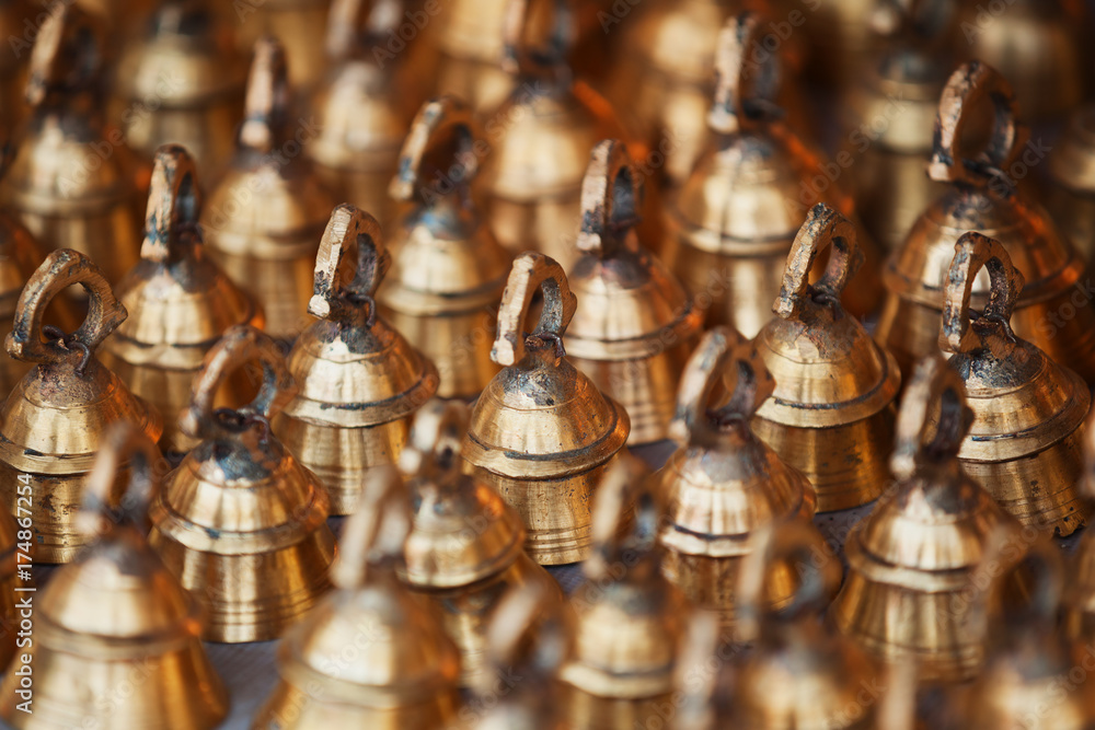 Large bells for cattle on the market counter. India, Pushkar