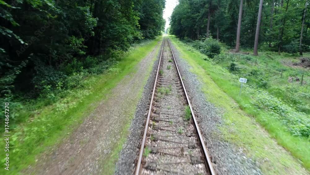Low altitude aerial flight over track on railway railroad also known as permanent way is structure consisting of rails fasteners railroad ties and ballast or slab track plus underlying subgrade 4k Low altitude aerial flight over track on railway railroad also known as permanent way is structure consisting of rails fasteners railroad ties and ballast or slab track plus underlying subgrade 4k