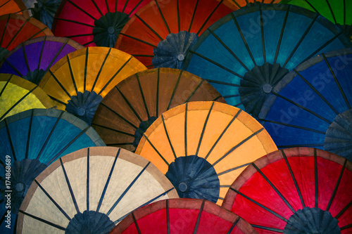 Colored paper Traditional umbrellas are sold in market. Laos