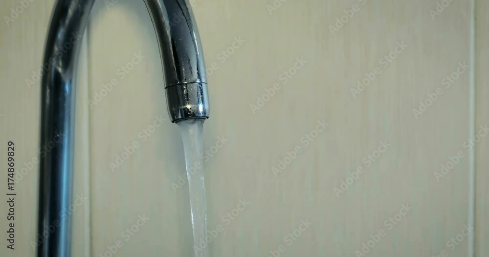 Dolly abstract large jet flowing out of a tap. 4K. Dolly abstract large jet flowing out of a tap. 4K.
