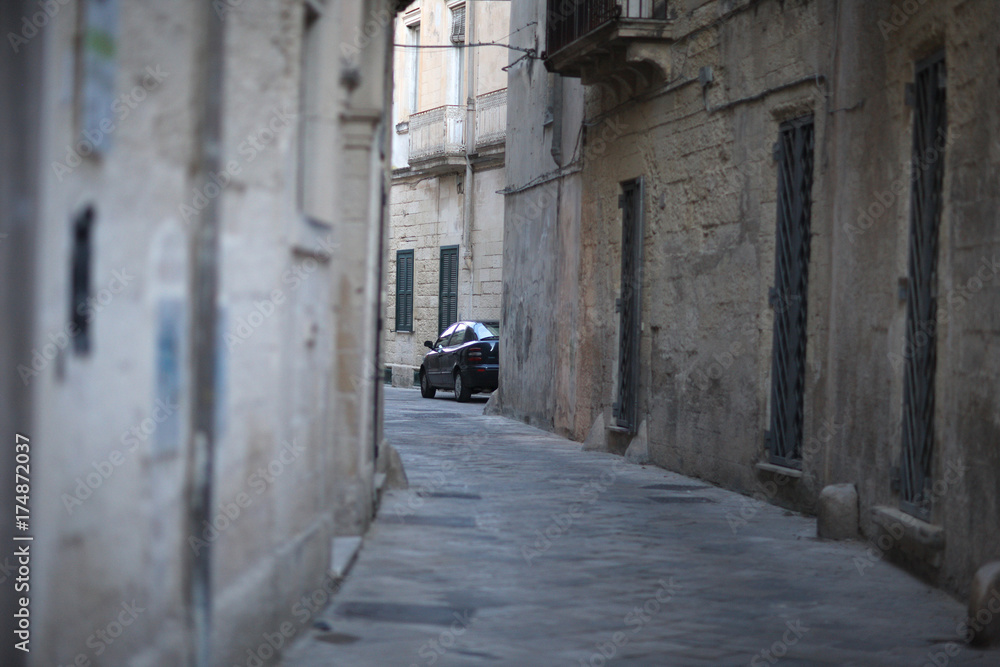 Fototapeta premium Narrow curve of the street of the ancient Mediterranean city