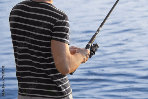 Man fishing on river, closeup