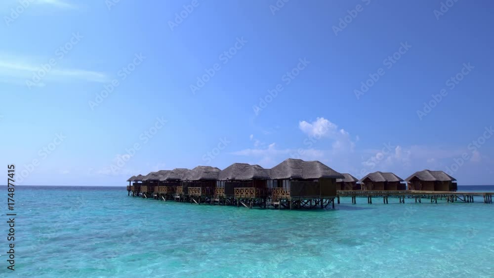 Tropical travel card with pristine beach and water bungalows at maldivian island Tropical travel card with pristine beach and water bungalows at maldivian island
