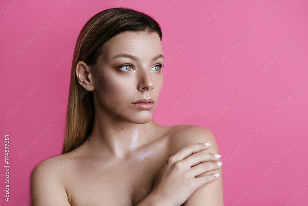 beautiful girl with natural make-up on a pink background beautiful girl with natural make-up on a pink background