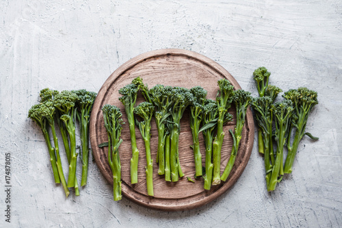 Broccolini, broccoli florets green vegetable broccolini grows baby broccoli vegan food grey table overhead photo