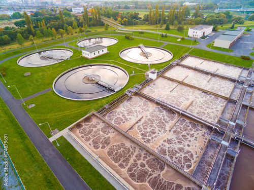 Aerial view to sewage treatment plant in green fields. Grey water recycling. Waste management for 165, 000 inhabitants of Pilsen city in Czech Republic, Europe. 