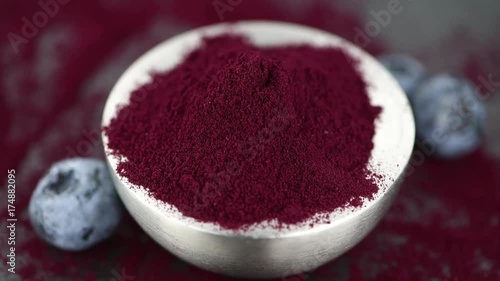 Blueberry powder on a rotating plate as 4K UHD footage (seamless loopable)