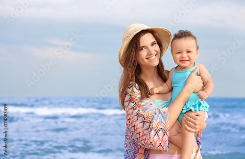 Happy mother with little da...