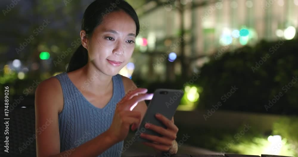 Woman use of mobile phone in outdoor cafe Woman use of mobile phone in outdoor cafe