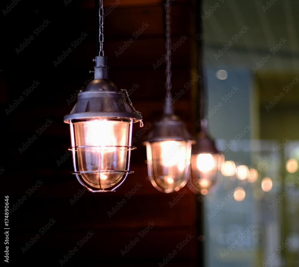 Lamps are used for lighting and are used to decorate a place within a coffee shop.