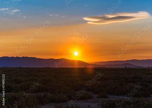 Sunset at the mouth of the Ebro Delta and wetlands, Tarragona, Catalonia, Spain. Copy space for text.
