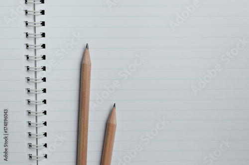 Pencils On The Blank Page of Notebook.