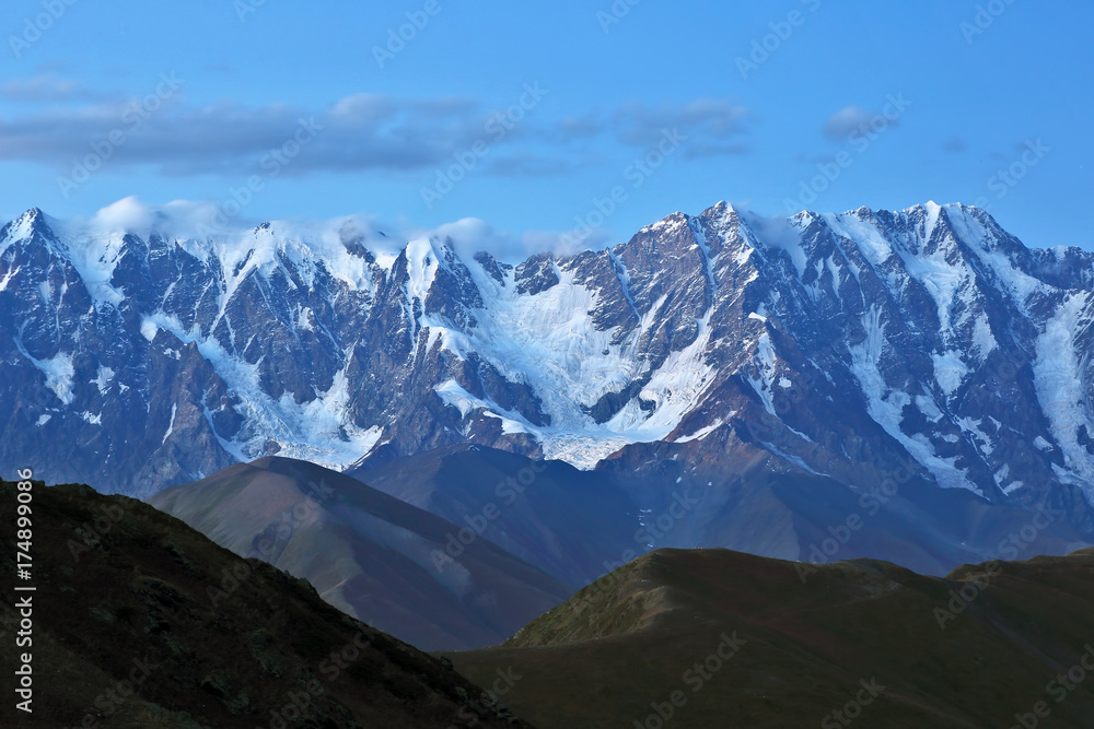 The Caucasus mountain range in the evening.