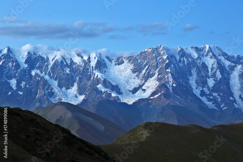 The Caucasus mountain range in the evening. © photosaint