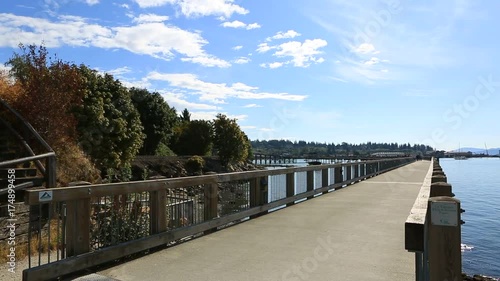 High definition 1080p panning movie of Boulevard Park along Bellinigham Bay in Washington State on a clear blue sky day 1920x1080 hd