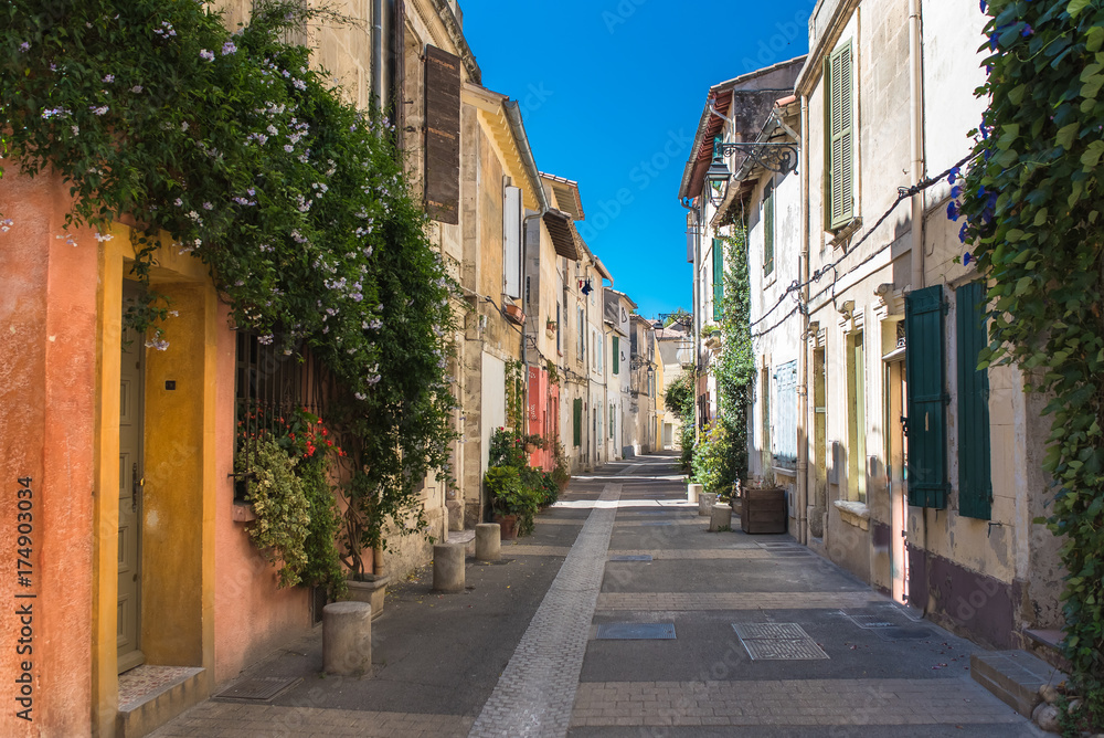 Arles in the south of France, typical paved side street of the city center
