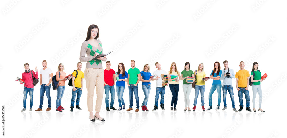 Large group of teenage students isolated on white background. Many different people standing together. School, education, college, university concept. Large group of teenage students isolated on white background. Many different people standing together. School, education, college, university concept.