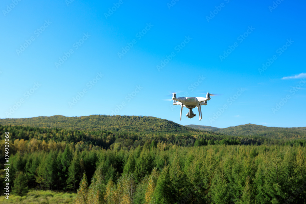 drone flying in the autumn forest
