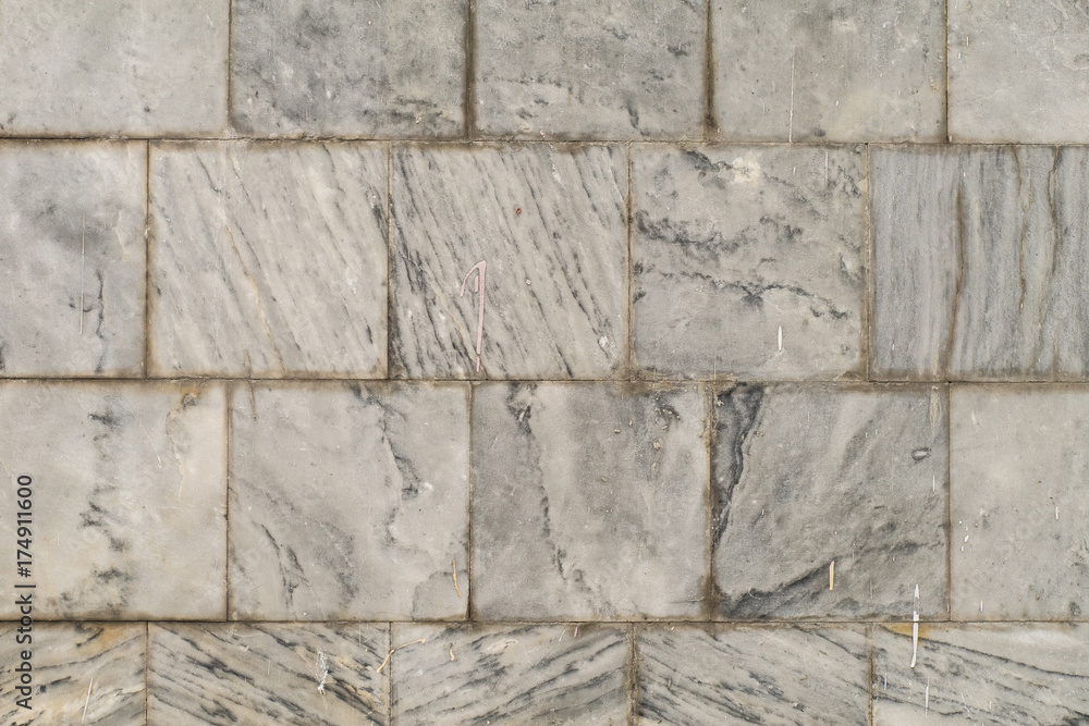 The texture of the brushed stone, marble. Different shades of gray with splotches, stripes, lines. Close-up. The texture of the brushed stone, marble. Different shades of gray with splotches, stripes, lines. Close-up.