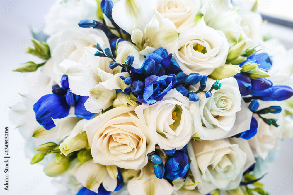 Beautiful wedding bridal bouquet of blue and white roses