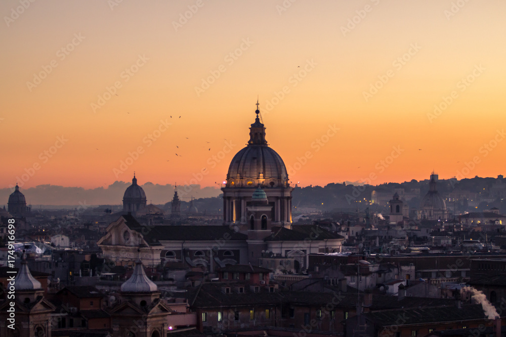 Panorama view of Rome at sunset with St Peter Cathedral