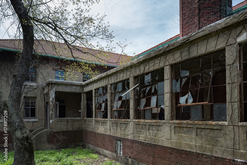 broken windows in ellis island abandoned psychiatric hospital interior rooms photo