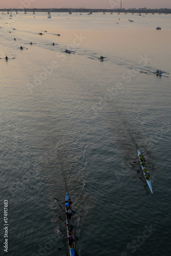 City of the Dniepr, Ukraine (Dnipropetrovsk, Dnepr city, Dnipro). Holiday city day. Regatta 2017 held on the river Dnipro with sunset in the backgrounds. Group of People Paddling on Kayaks. 