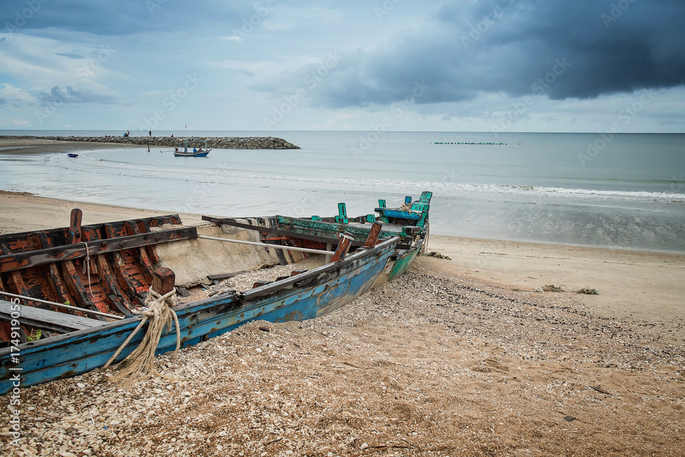 A old abandoned fishing boat and colorful sky In Thailand A old abandoned fishing boat and colorful sky In Thailand
