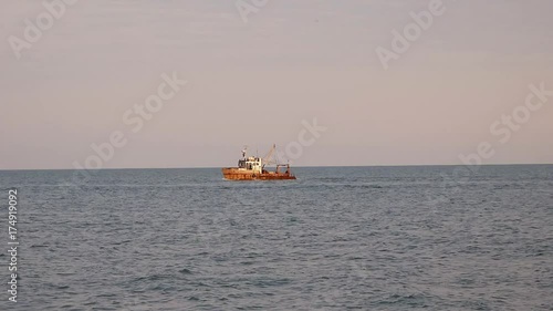 An old fishing boat in the sea