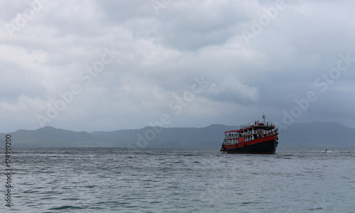 ship at sea with tourists in cloudy weather