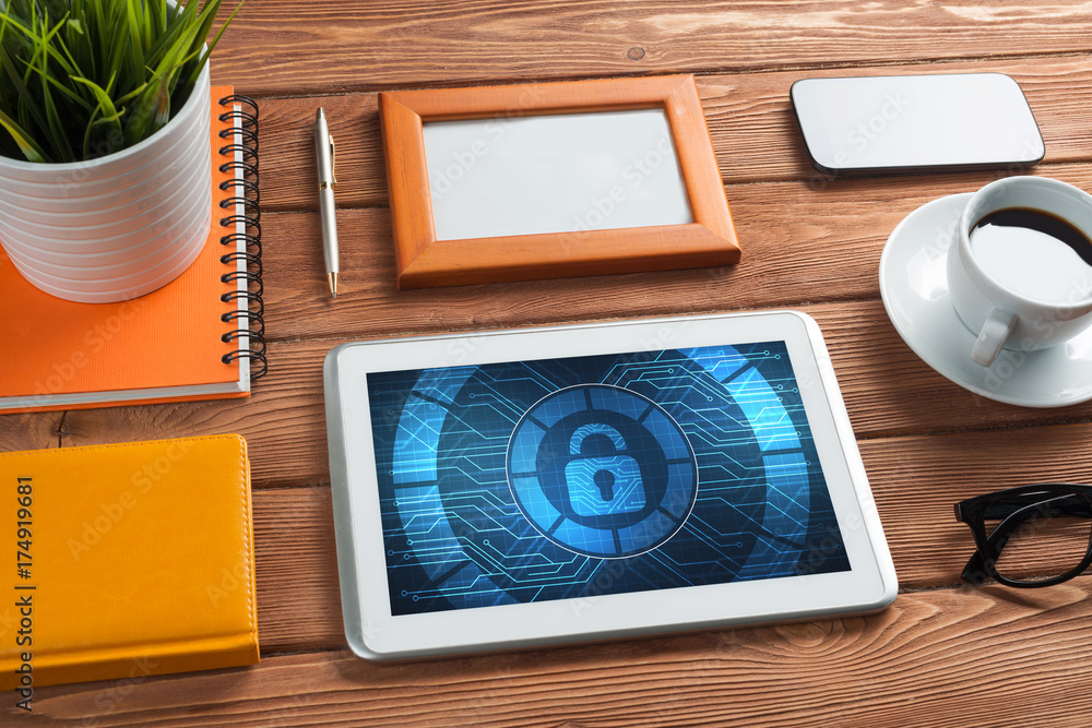 Web security and technology concept with tablet pc on wooden table Web security and technology concept with tablet pc on wooden table