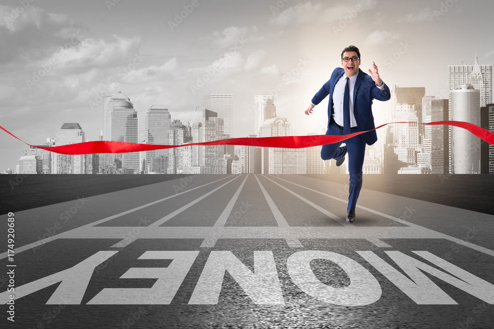Young businessman chasing money in financial business concept Young businessman chasing money in financial business concept
