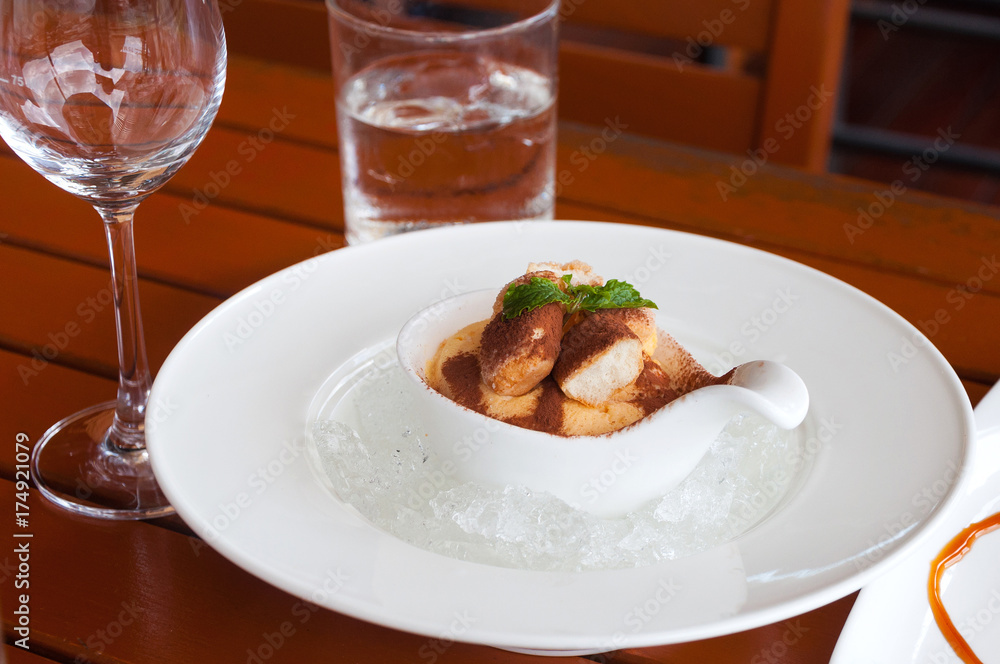 delicious tiramisu dessert on a porcelain plate