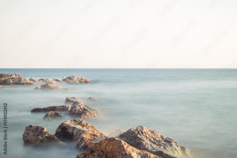 seaside with many rock, long exposure. long exposure of sea and rocks, aegean sea Balikesir Turkey seaside with many rock, long exposure. long exposure of sea and rocks, aegean sea Balikesir Turkey