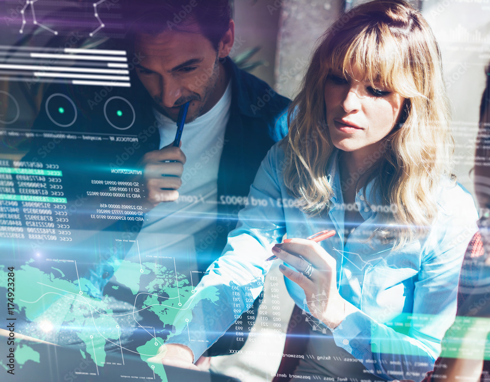 © SFIO CRACHO - Concept of digital diagram,graph interfaces,virtual screen,connections icon on blurred background.Group of two young coworkers working together at modern coworking studio.Horizontal. © SFIO CRACHO - Concept of digital diagram,graph interfaces,virtual screen,connections icon on blurred background.Group of two young coworkers working together at modern coworking studio.Horizontal.