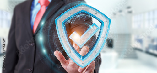 Obraz na płótnie Businessman using modern data shield antivirus 3D rendering