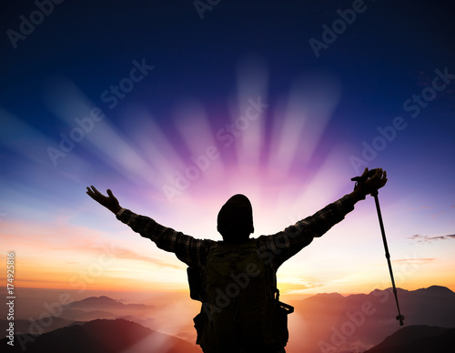 man on the top of mountain watching sunrise