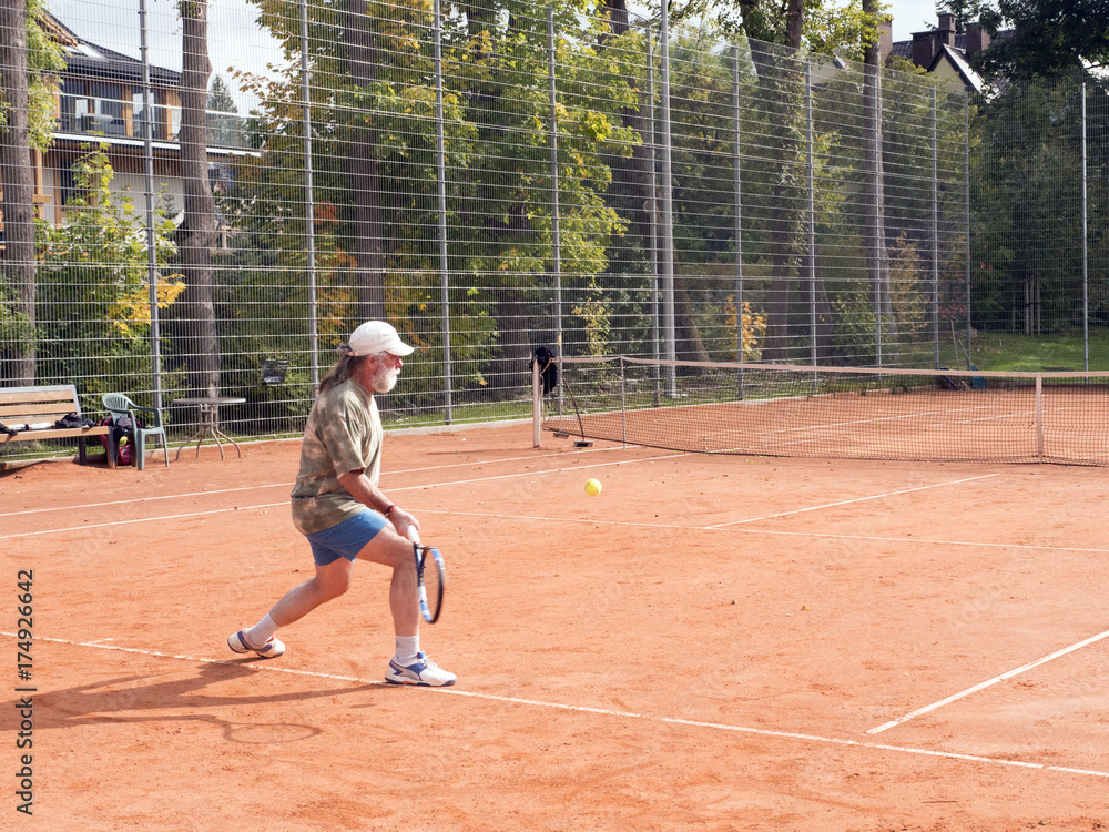 A man on the court plays tennis