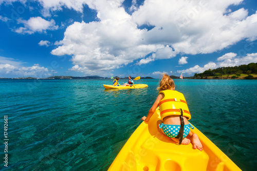Family kayaking at tropical ocean © BlueOrange Studio