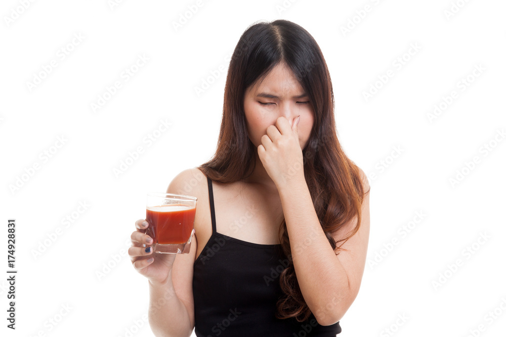 Young Asian woman hate tomato juice. Young Asian woman hate tomato juice.