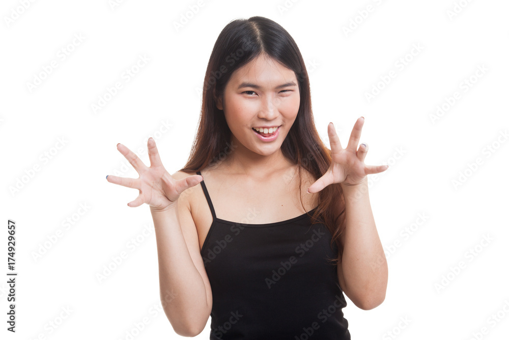 Young Asian woman with spooky hands gesture. Young Asian woman with spooky hands gesture.